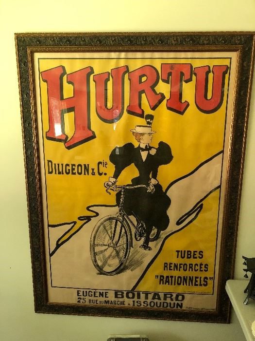 A poster of a man riding a bicycle.